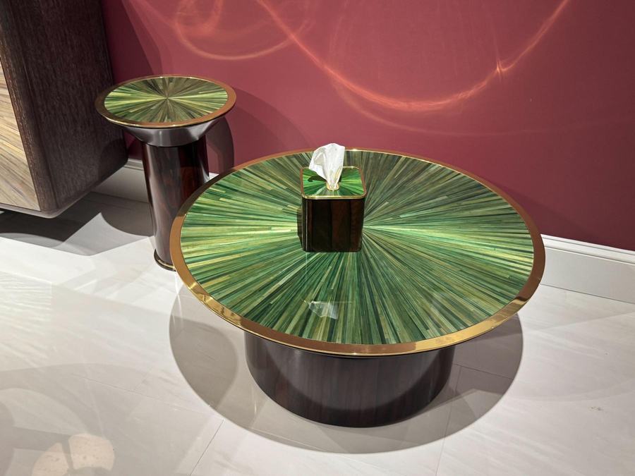 Round side table with a green starburst inlay top